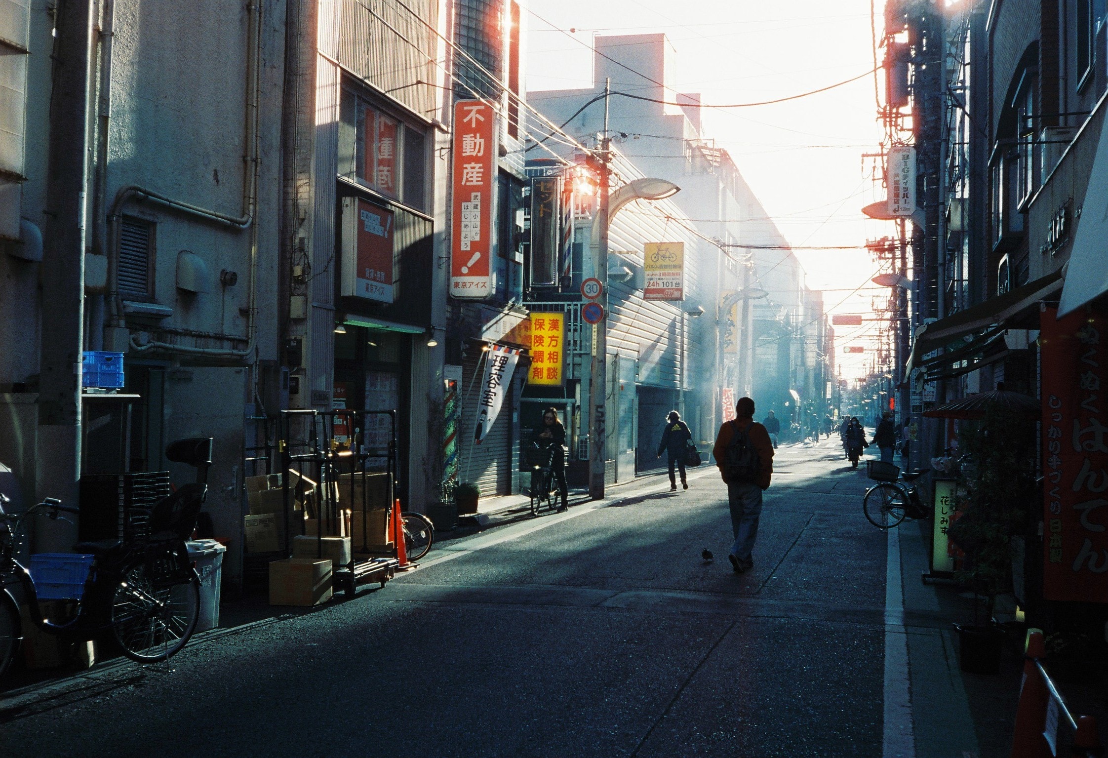 Morning light down a side street, backlit and quiet.